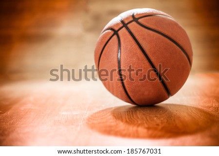 Basketball on a court floor as a sports and fitness Basketball on a court floor as a sports and fitness