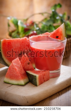 Fresh watermelon juice with sliced watermelon