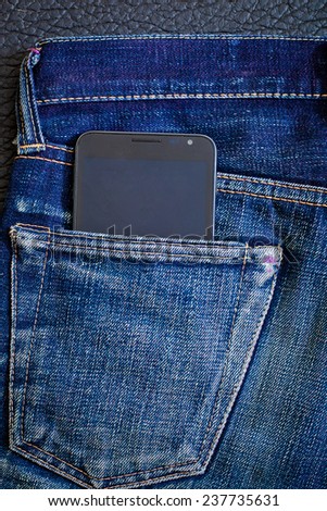 Mobile phone in pocket with jeans