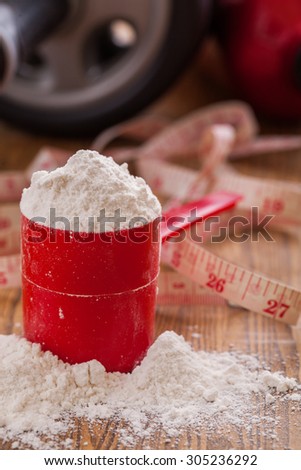 Scoop of whey protein isolate powder