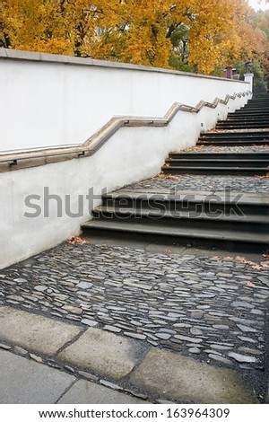 View of historic stone staircase with railings