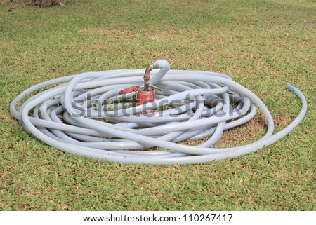 Watering Hose On Grass