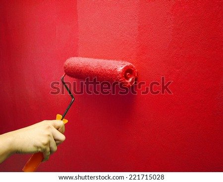 Hand Painting Red Color on The Wall