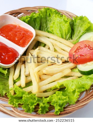 Traditional french fries with gravy and vegetables