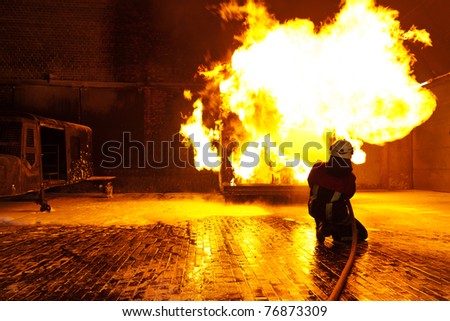 fire-fighter trains extinguishing a fire