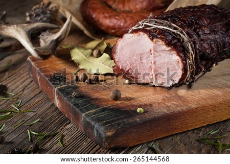 Smoked ham on a chopping board.