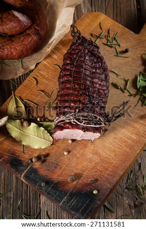 Smoked ham on a chopping board.