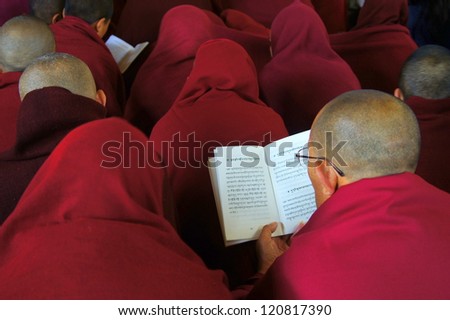 MCLEOD GANJ, INDIA - FEB 12: Tibetan refugees pray at the seat of the Dalai Lama in McLeod Ganj (Himachal Pradesh/ India) on February 12th, 2012.