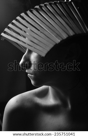 portrait photo of beautiful profile woman face wearing unusual accessory