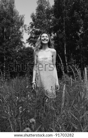 portrait photo of beautiful laughing girl in black and white