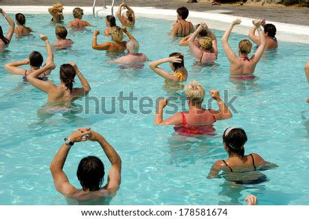 People doing water aerobic in pool