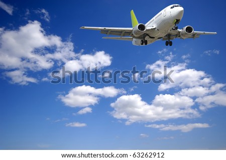 Air plane is flying. With blue and cloudy sky.