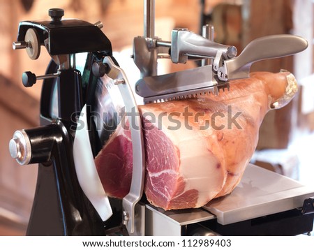 ham in cutting machine, old style