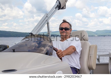 retired mature men driving a pontoon boat on a lake at daytime