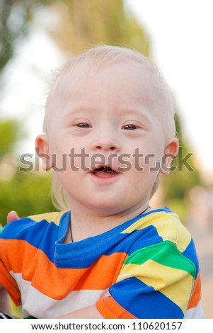 wonderful smiling baby boy with Down syndrome