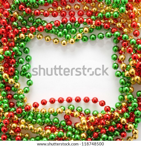 Frame of the red, green and gold Christmas beads. Ready for your text, logo or symbol, postcard