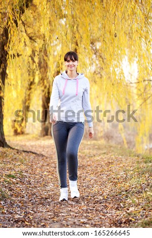 Woman jogging outdoors. Healthy lifestyle, fitness, jogging, active, young concept.