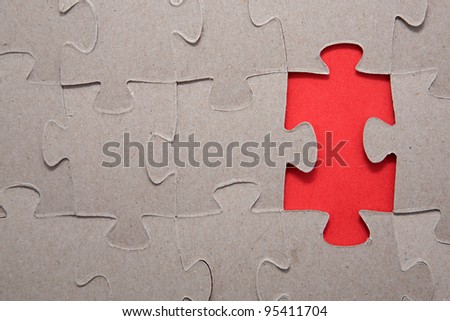 Completing the missing Jigsaw puzzle concept for business with completing the team with final person as background