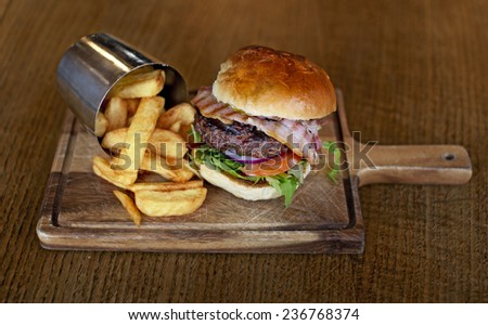 Tasty big burger with chips