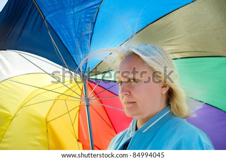 Woman with broken umbrella