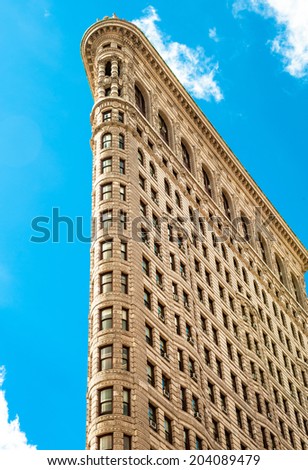 NEW YORK CITY - JUNE 10: Flat Iron building facade from Broadway on June 10, 2014 in Manhattan, New York City. The Flat Iron building, a groundbreaking architectural feat was completed in 1902