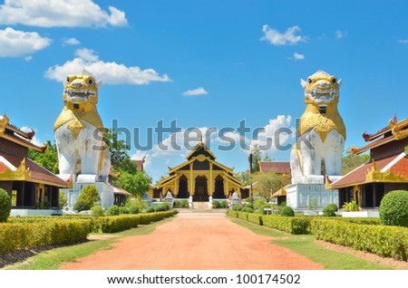 two lions with ancient building at Surasri Camp, Kanchanaburi, Thailand