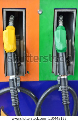 Several gasoline pump nozzles at petrol station, gasoline industry