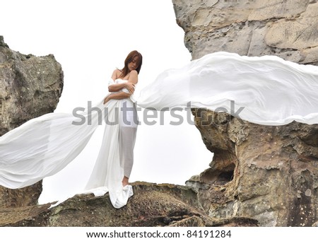 attractive woman in white dress looks like angel
