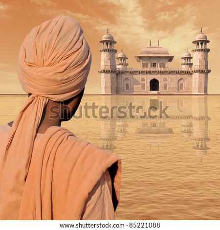 Man with turban near a palace in India.