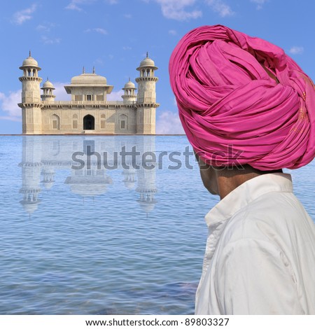 Man with turban near a palace in India.