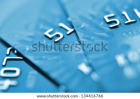 Debit cards in blue tone. Macro shot. Selective focus.