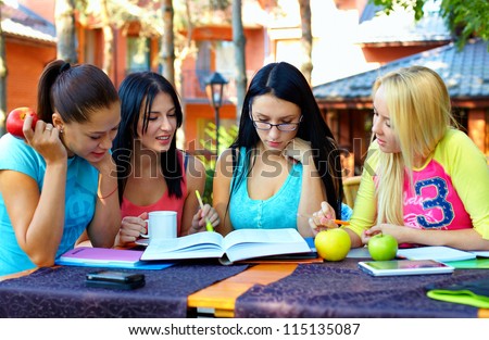 group of female students study for the exam, outdoors