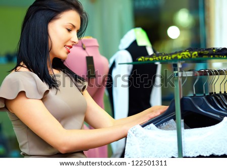 beautiful woman shopping in clothing store