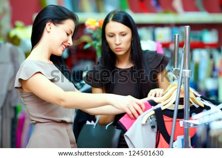 pretty women shopping in retail store