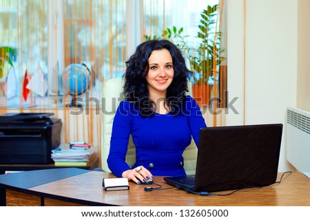 young business woman working in office
