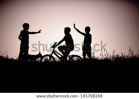 silhouette of teenage boys friends