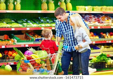 happy family buying food in supermarket