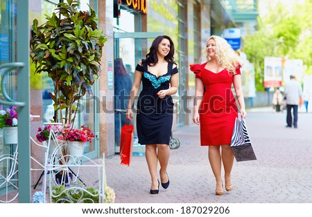 happy plus size women shopping