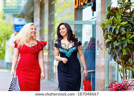 happy plus size women shopping
