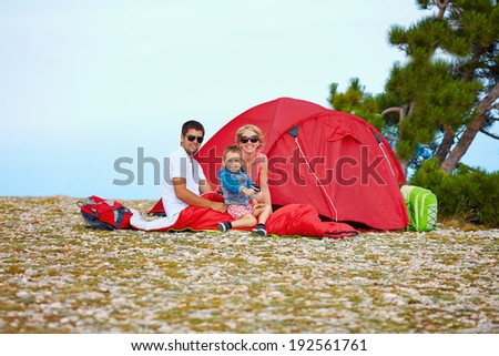 happy family camping in mountains