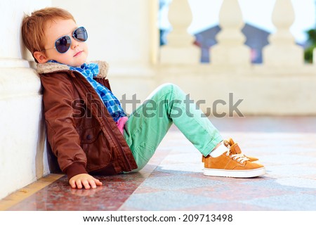 cute stylish boy in leather jacket and gum shoes cute stylish boy in leather jacket and gum shoes