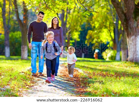 happy family on walk in park