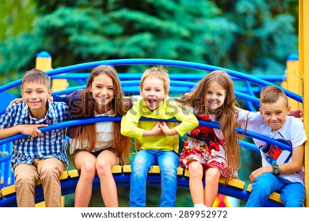 group of happy kids having fun on playground