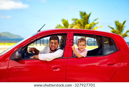 happy father and son traveling in the car on summer vacation