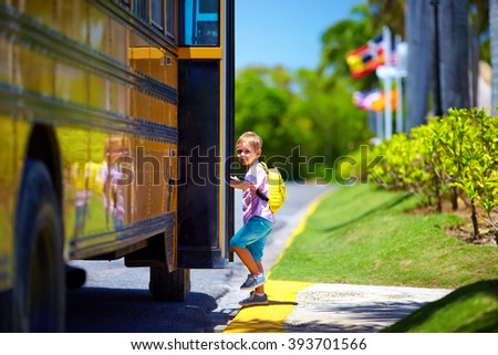 cute kid are getting on the bus, ready to go to school