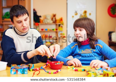 kids with special needs develop their fine motor skills in daycare rehabilitation center