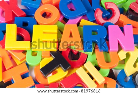 word learn over heaps of colorful letters