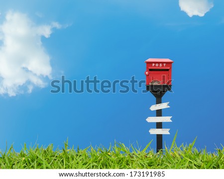 Mail box and wood sign with blue sky