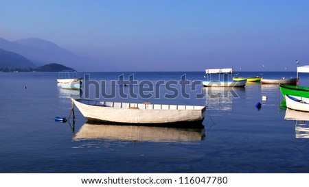 Fishing boats on a still water