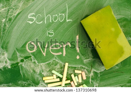 Green class board with School is Over handwriting